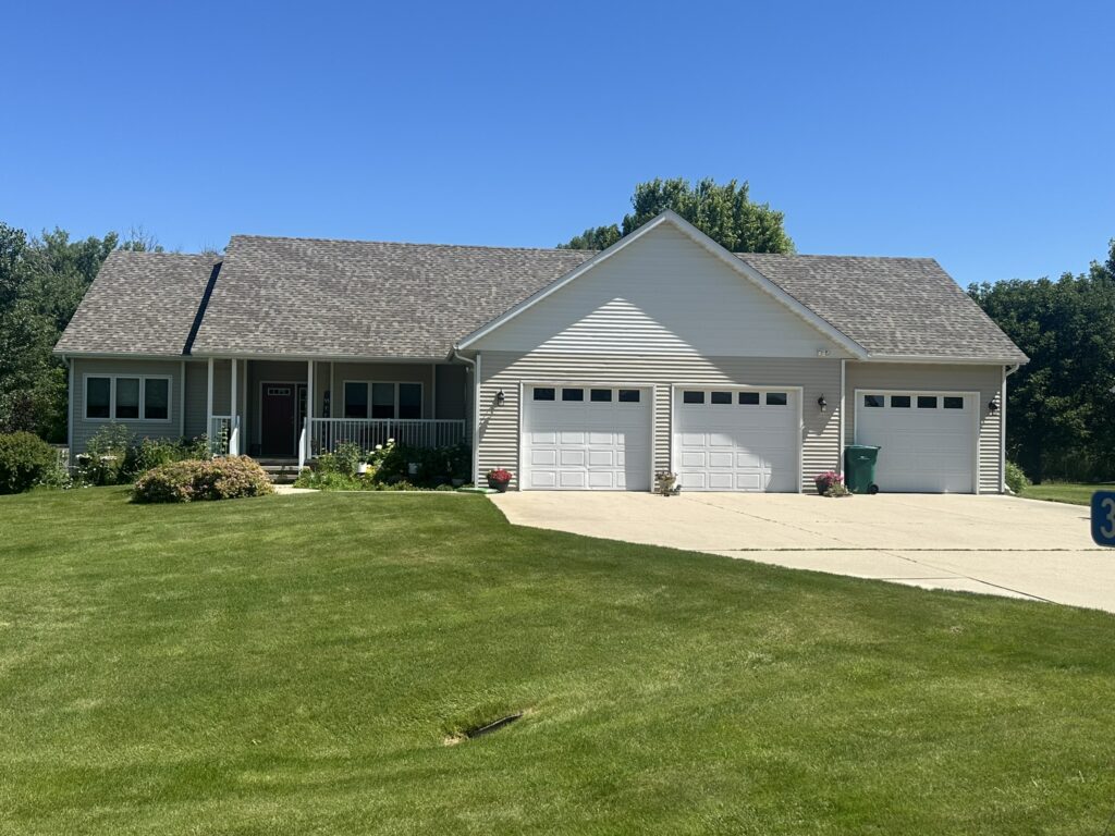New asphalt shingle roof on a home overlooking Lake Le Homme Dieu in Alexandria, MN