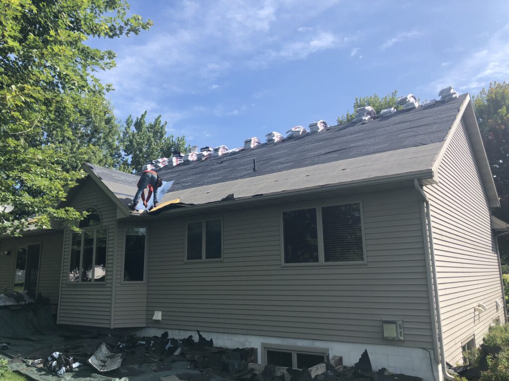 Roof replacement in progress on a home in Sauk Rapids, MN