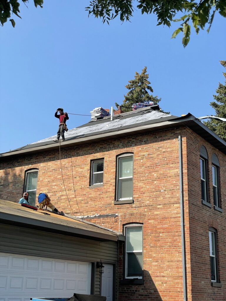 Steep-pitch roof work on a historic home in Sauk Centre, MN