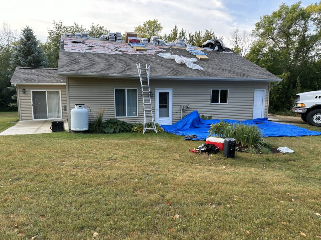 Smith Lake home near Osakis, MN during a full roof and siding replacement