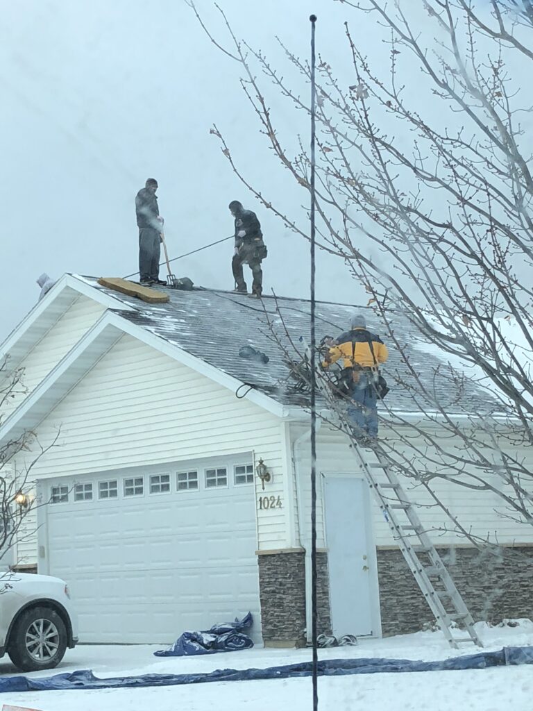 Winter emergency roof replacement in Perham, MN in heavy snow