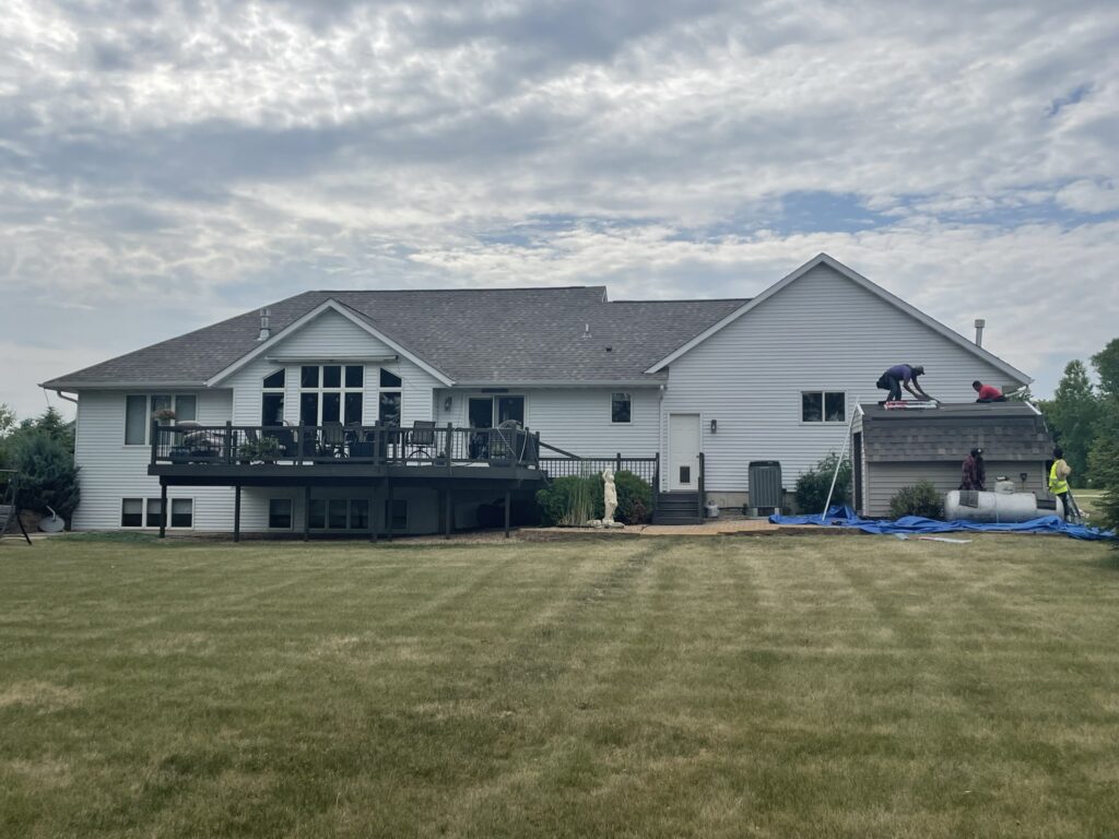 Roof replacement in progress — lawn tarped and protected